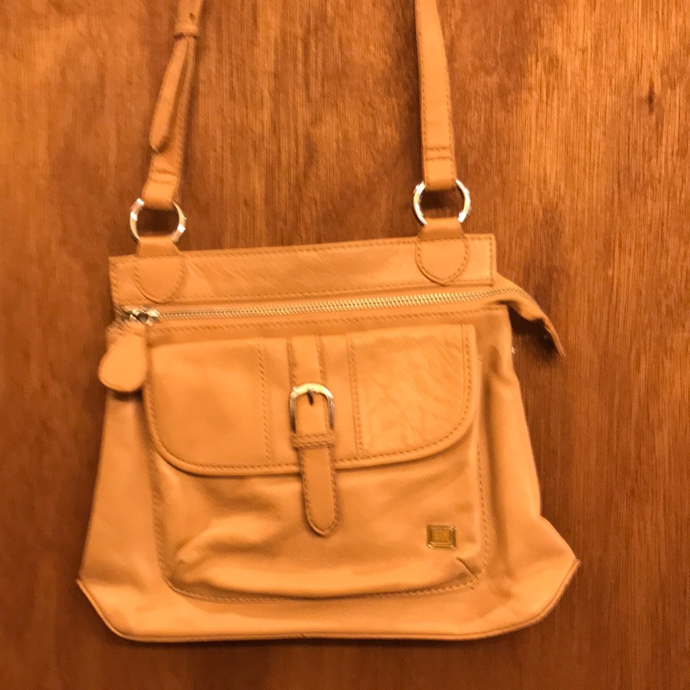This Sak bag is made from soft leather. No scuffs or stains. Great looking bag!